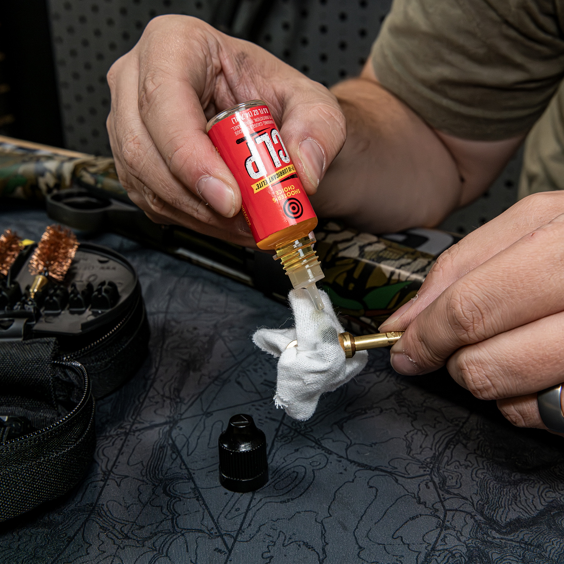 Lubricating the rifle's parts with a napkin