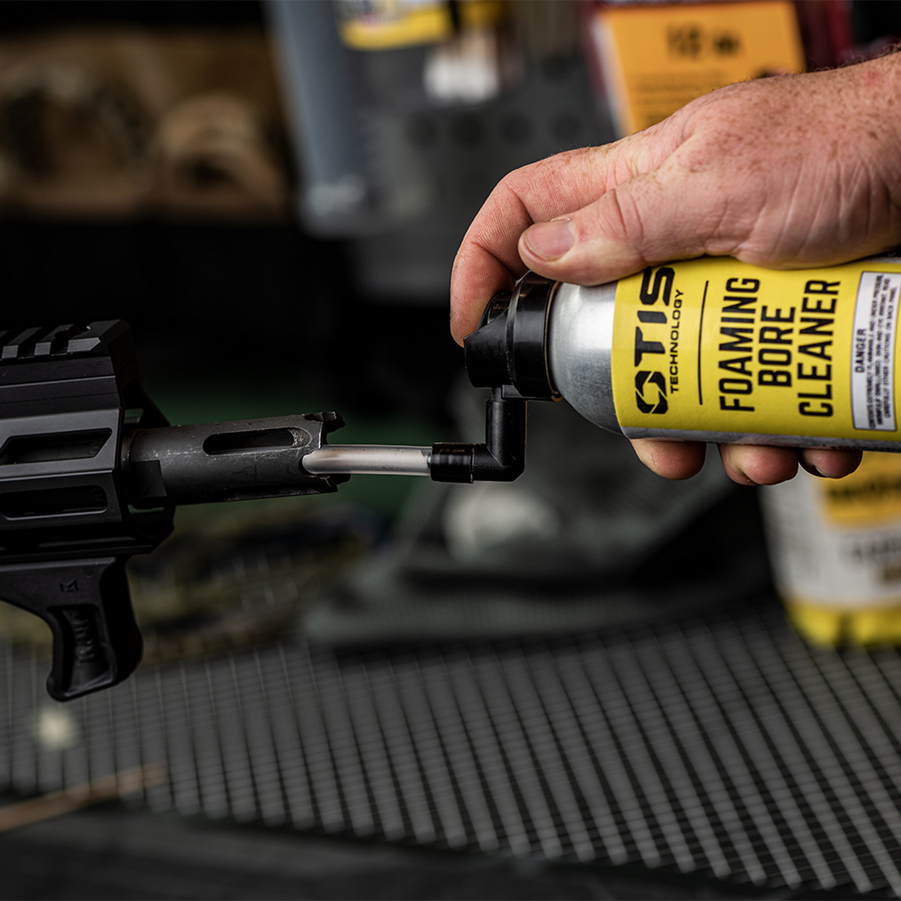 Lubricating the barrel bore of a firearm using a spray can