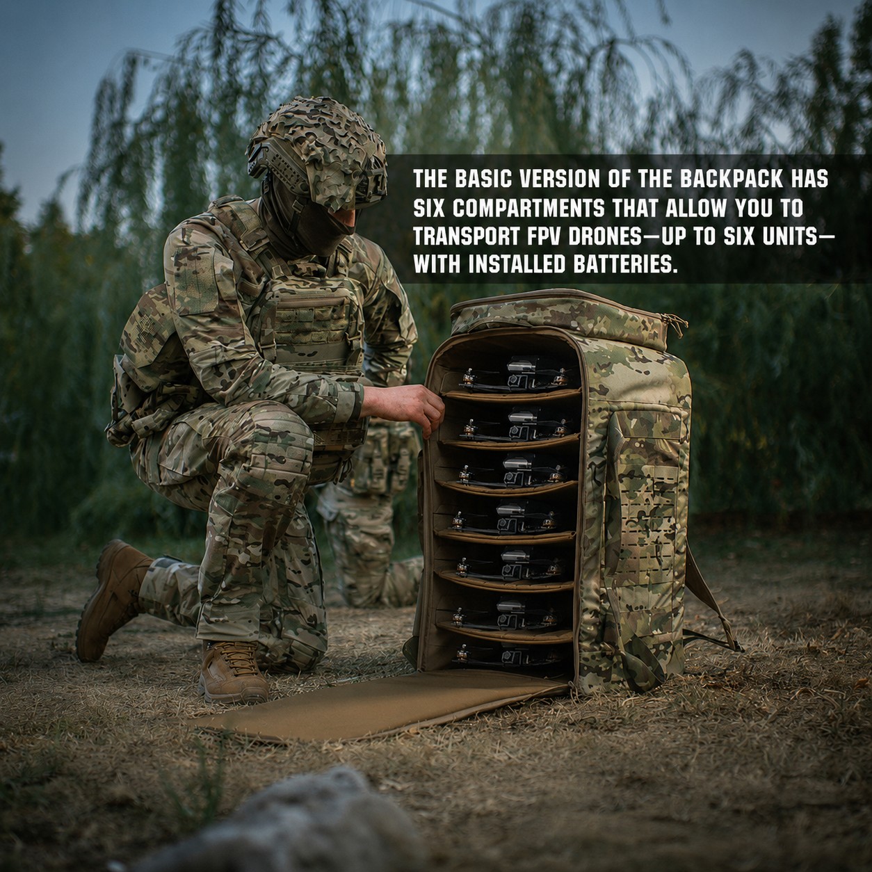 A soldier is kneeling next to an open backpack filled with FPV drones