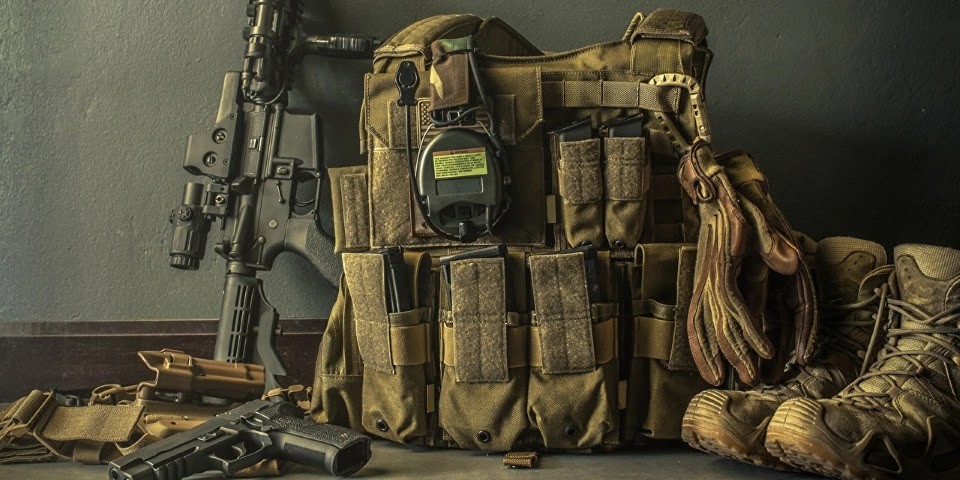 Firearm next to a tactical backpack