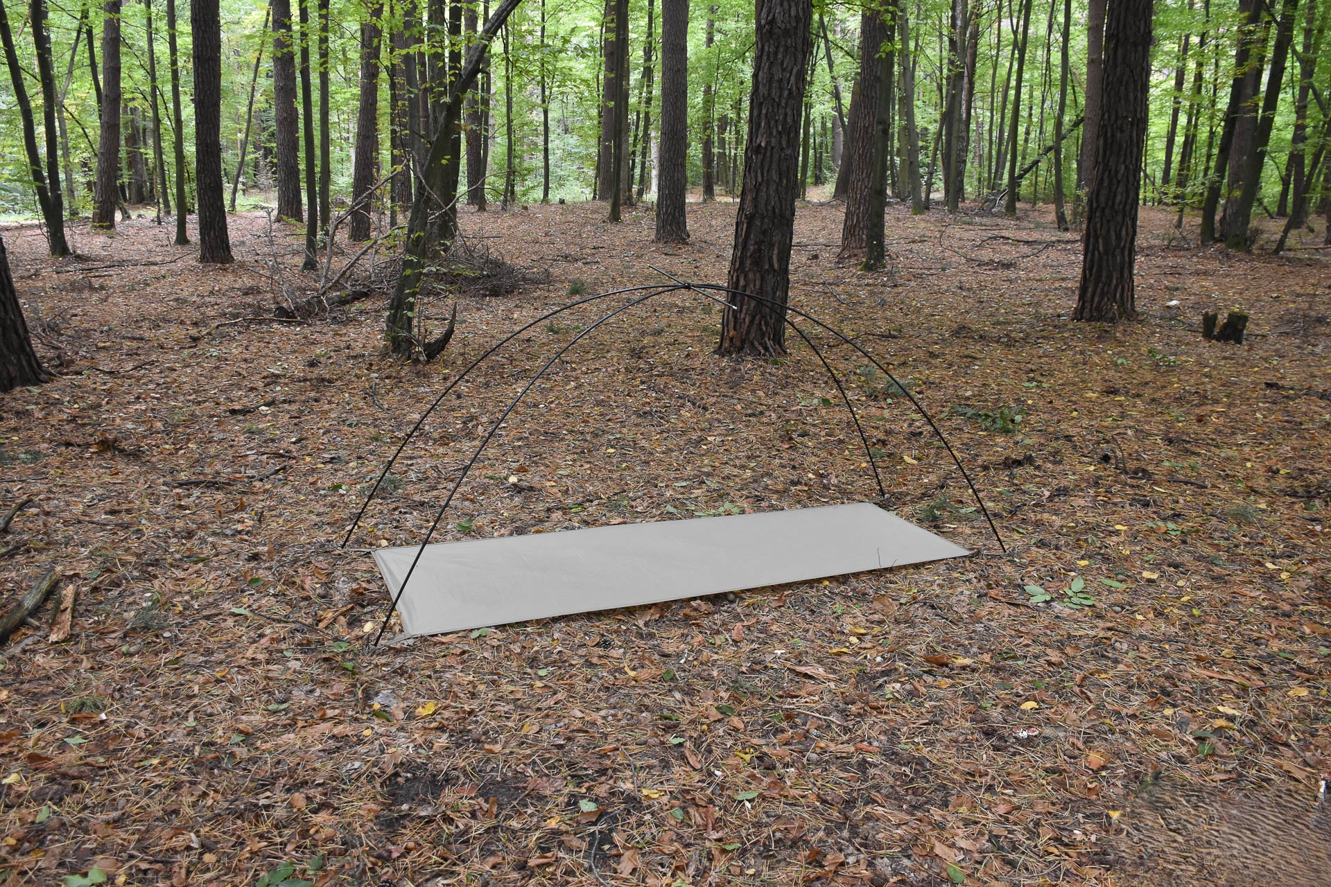 The tent's cross-shaped frame has been set up