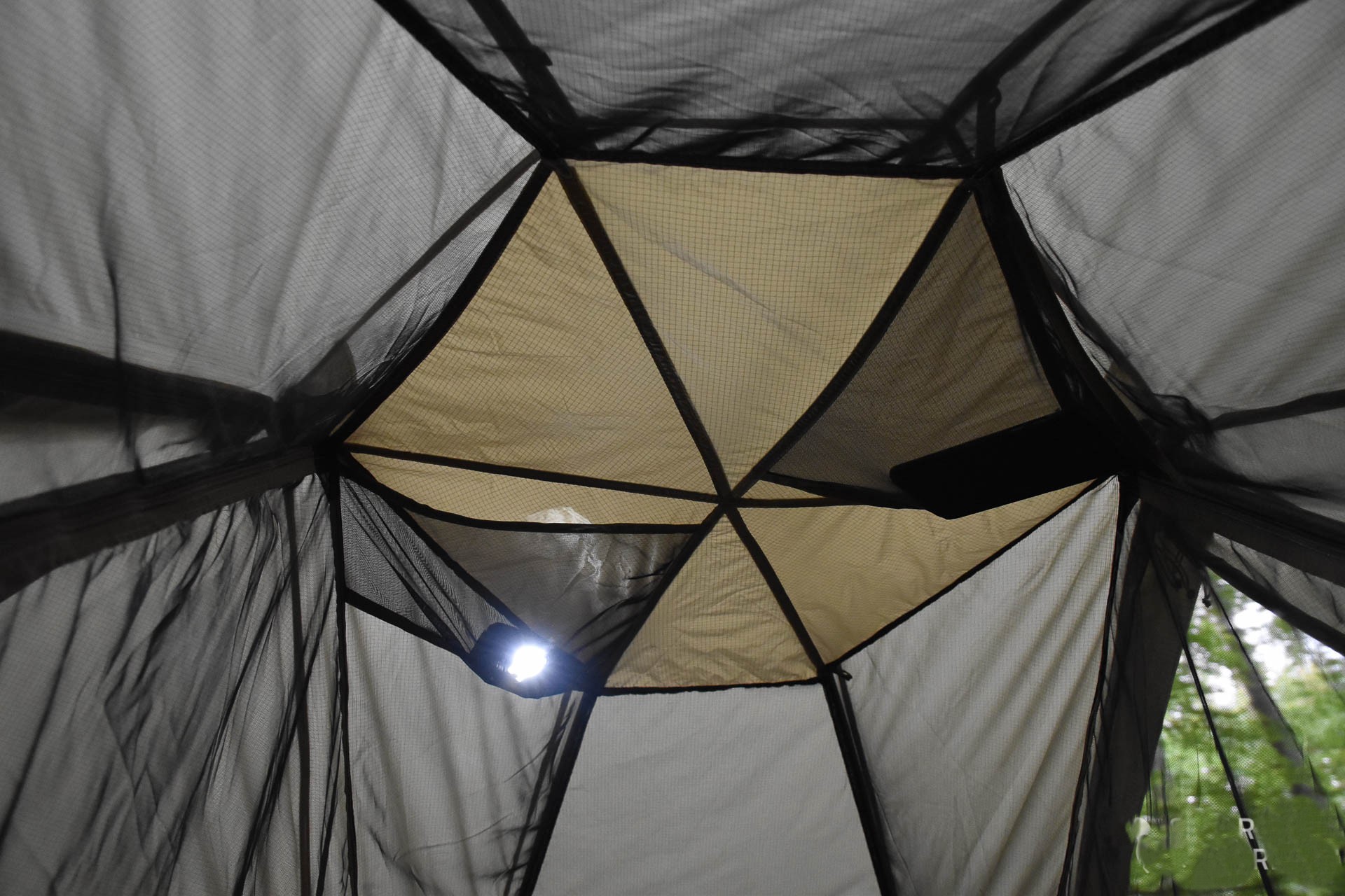 Mosquito netting along the entire perimeter of the tent's roof and walls