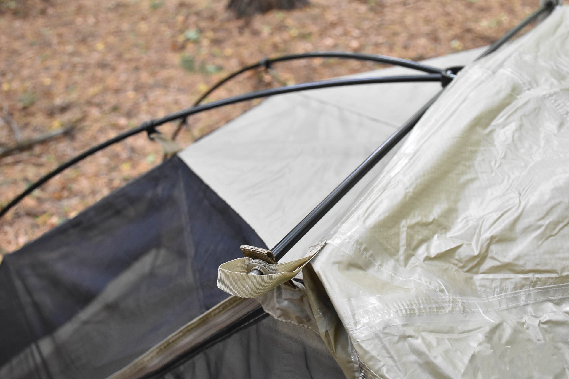 Pulling the outer layer over the tent frame