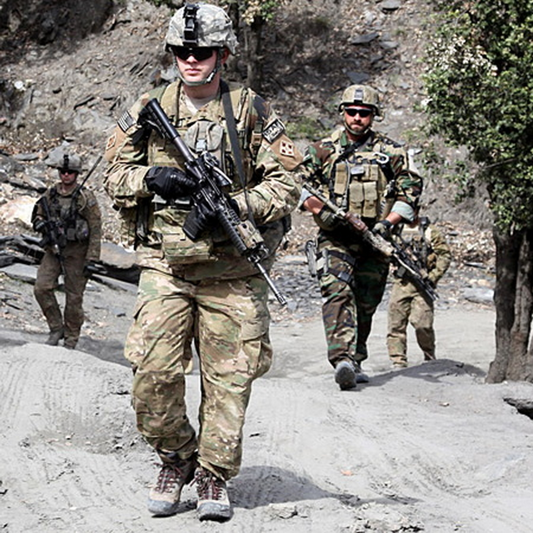 Mid-season combat boots worn by American soldiers in mountainous terrain