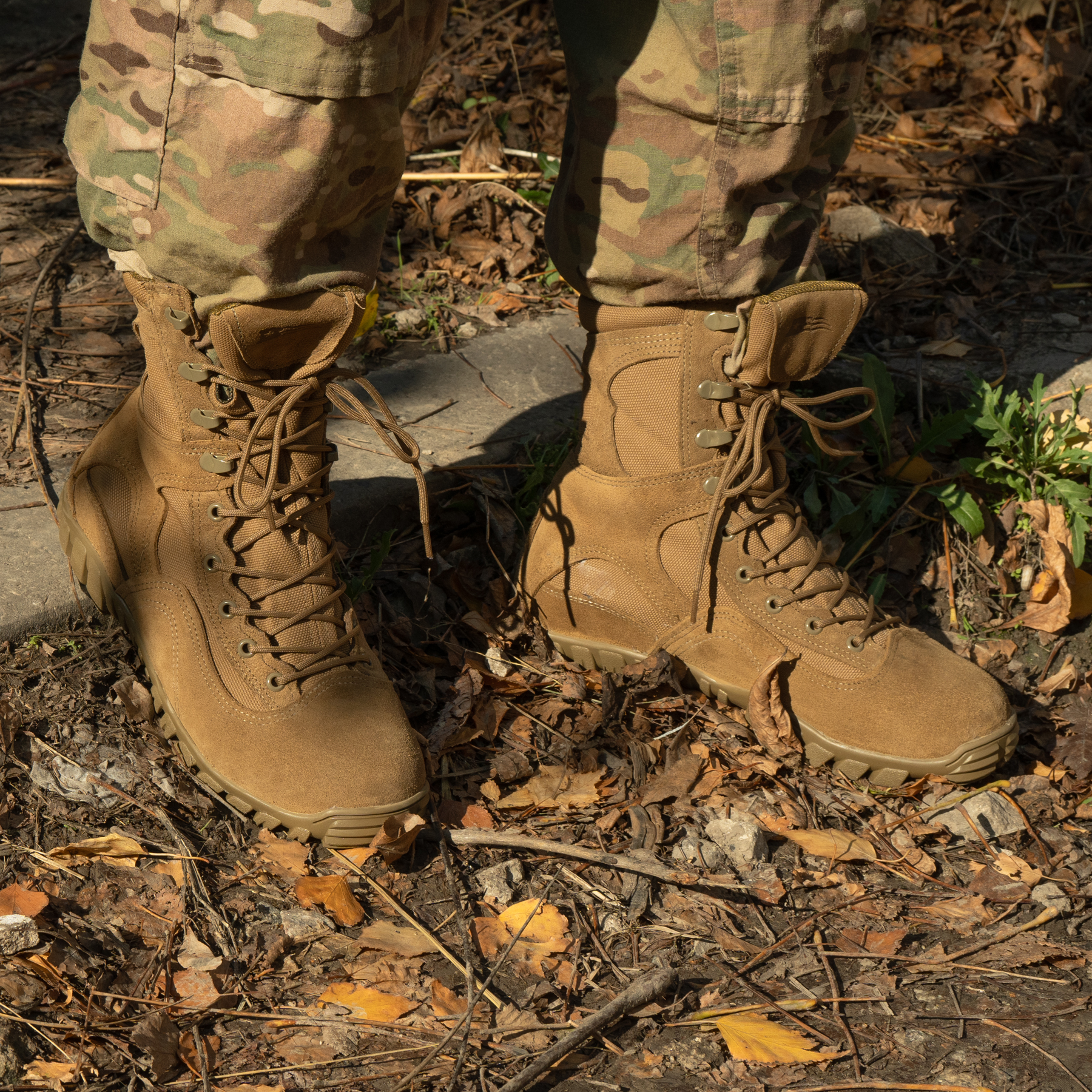 Mid-season boots on fallen leaves