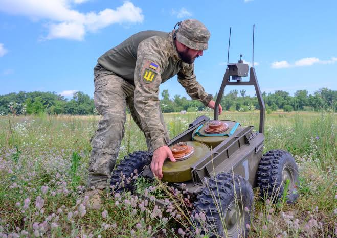 Transporting anti-tank mines using a ground-based drone